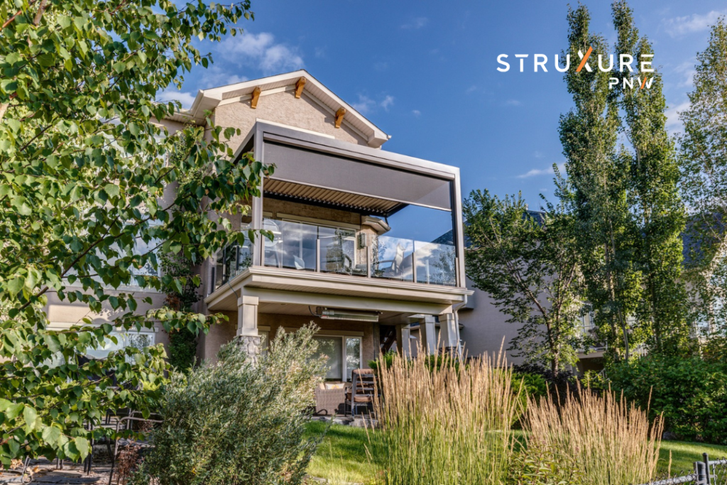 Second story screened in porch balcony on a sunny day with comfortable outdoor furniture and open sightlines through the screening material